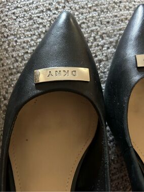 DKNY Black Pointed Toe Heels with Gold Logo Accent